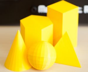 Different 3d shapes in bright yellow