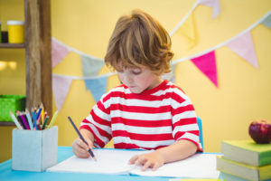 supporting struggling writers. Photograph of a young child writing