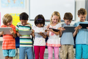 Children reading tablets