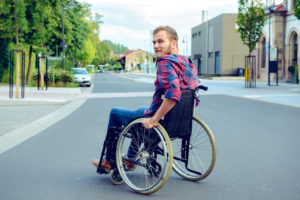 Accessibility is Important - Accessibility means giving people access to the world. Image shows man in a wheelchair