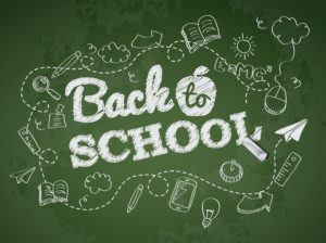 The transition from primary to secondary school: image shows a blackboard saying "Back to school"