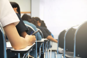 JCQ Access Arrangement Update: Image shows student sitting exam