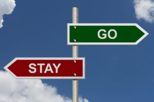 Teacher Retention: Image shows sign post saying "Stay" and "Go"
