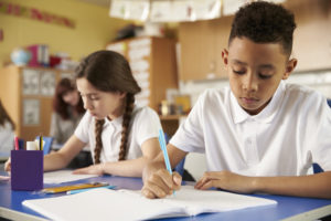  encouraging reluctant writers - Image shows school children in classroom writing