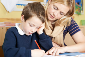 Working Memory Issues  - Images shows child in uniform struggling